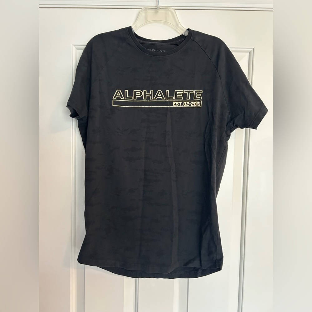 Size medium black with gold lettering Alphalete shirt sleeve shirt